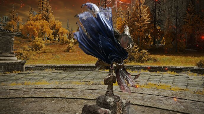 Captura de pantalla del Anillo de Elden en la que se ve al jugador dando una voltereta con el arma Trituradora de Gigantes
